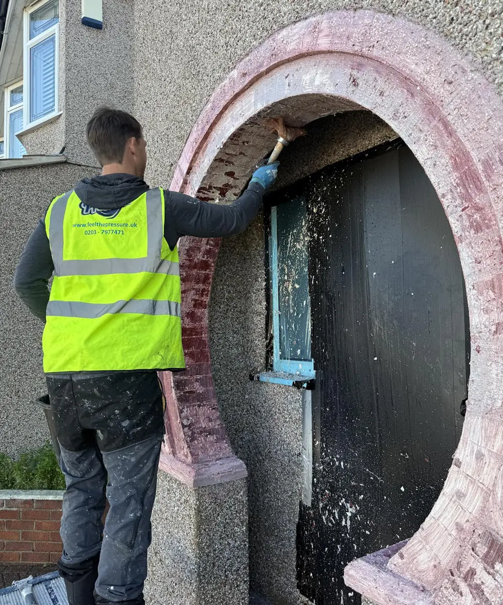 applying-paint-stripper-during-brick-paint-removal-on-a-london-home.webp